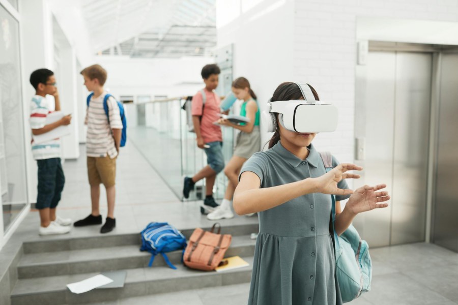 Student using VR headset in a modern school